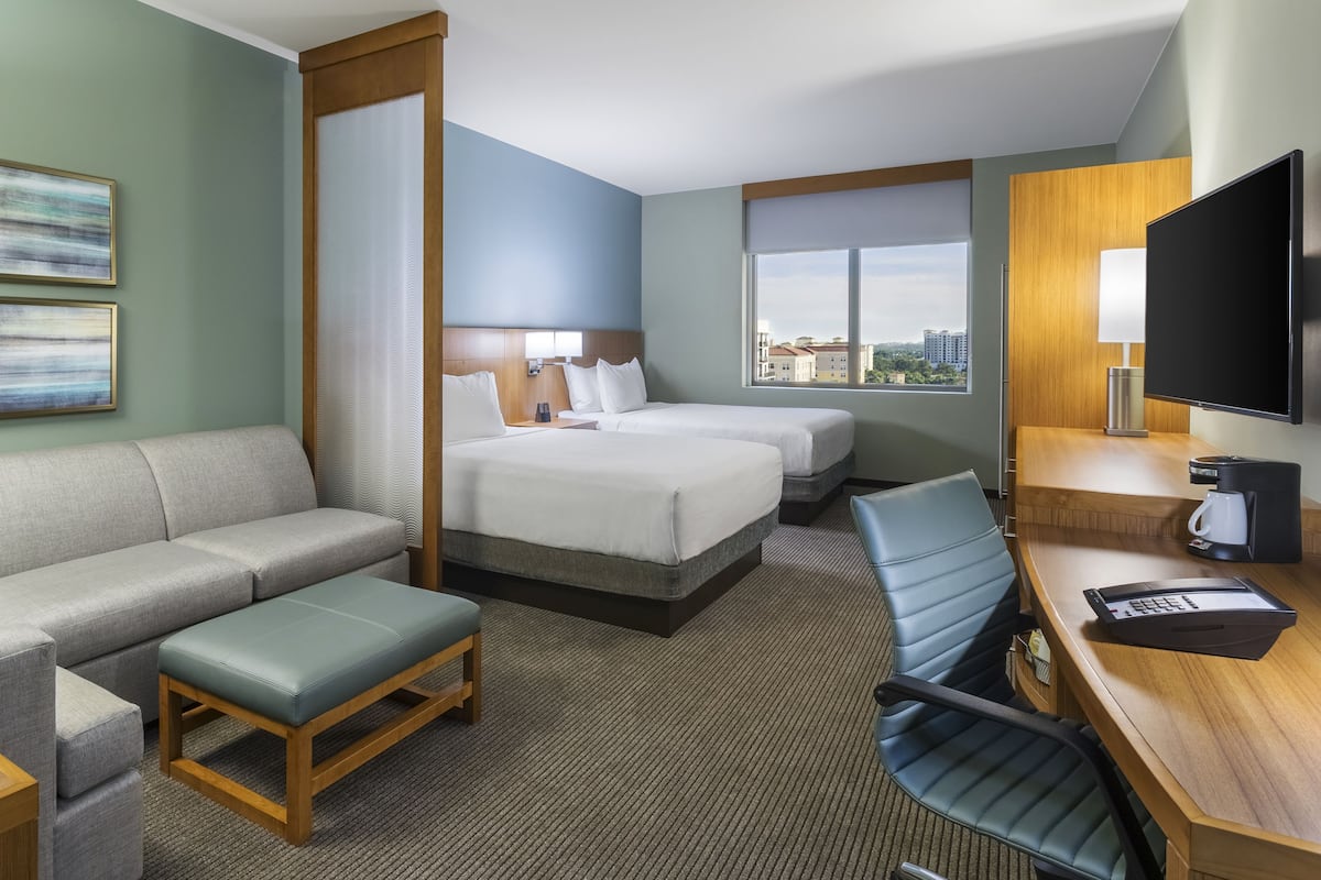 Desk, laptop workspace, blackout drapes, iron/ironing board