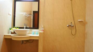 Shower, free toiletries, slippers, towels
