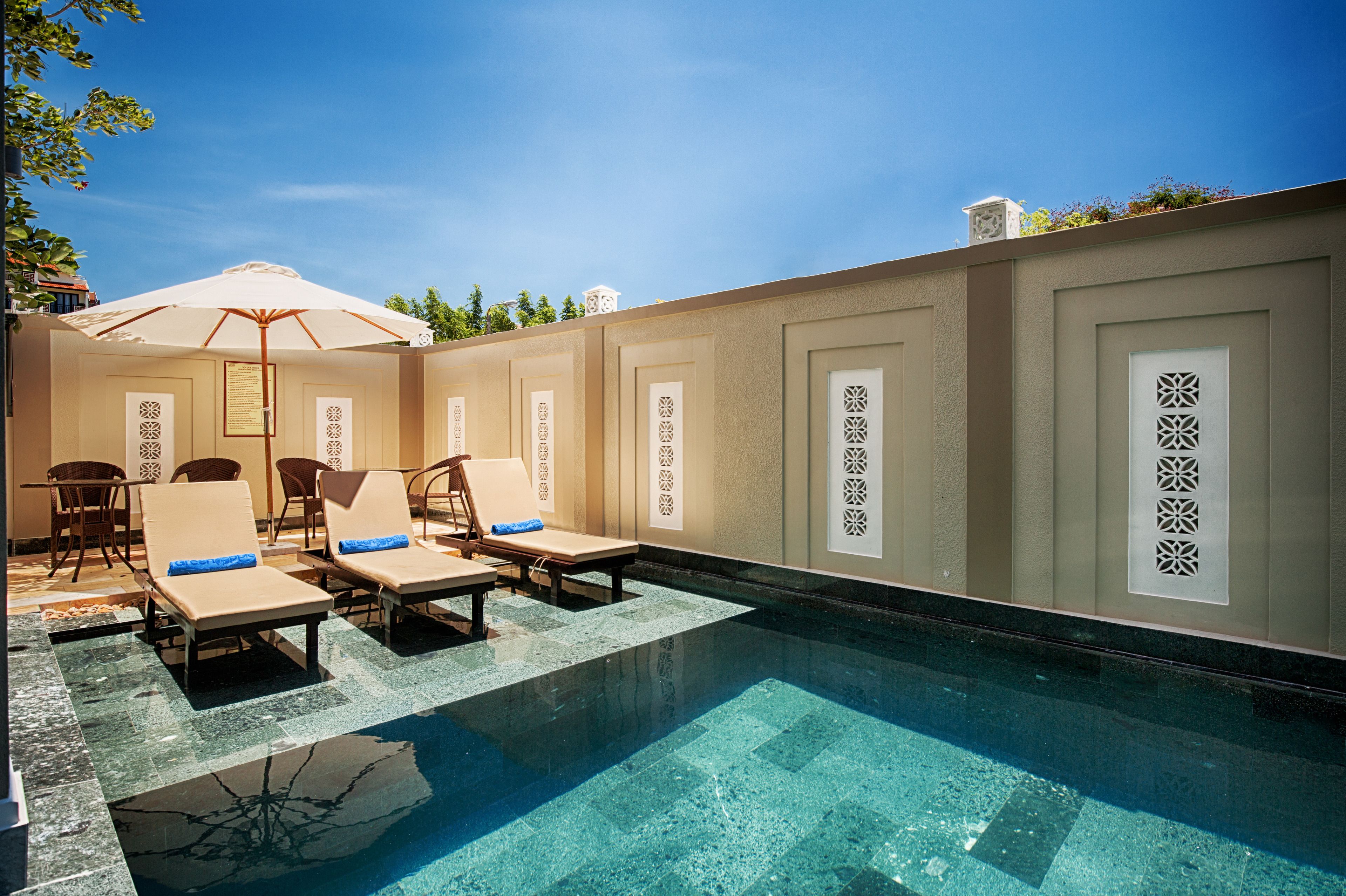 outdoor pool, pool umbrellas, pool loungers