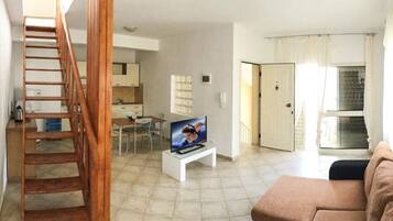 Apartment, 1 Bedroom | Living room | Flat-screen TV