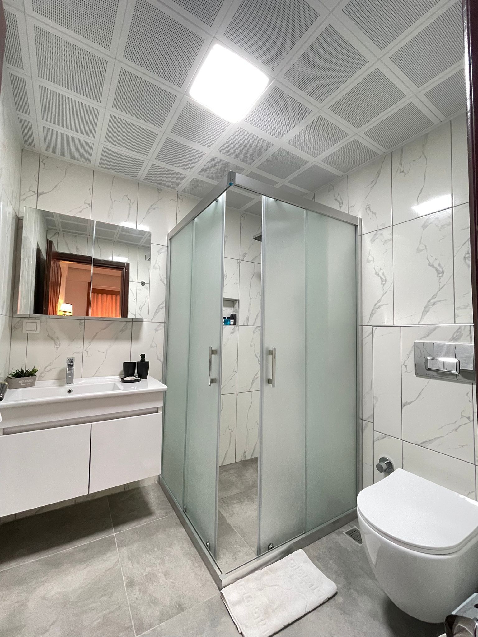 Hair dryer, slippers, towels, soap