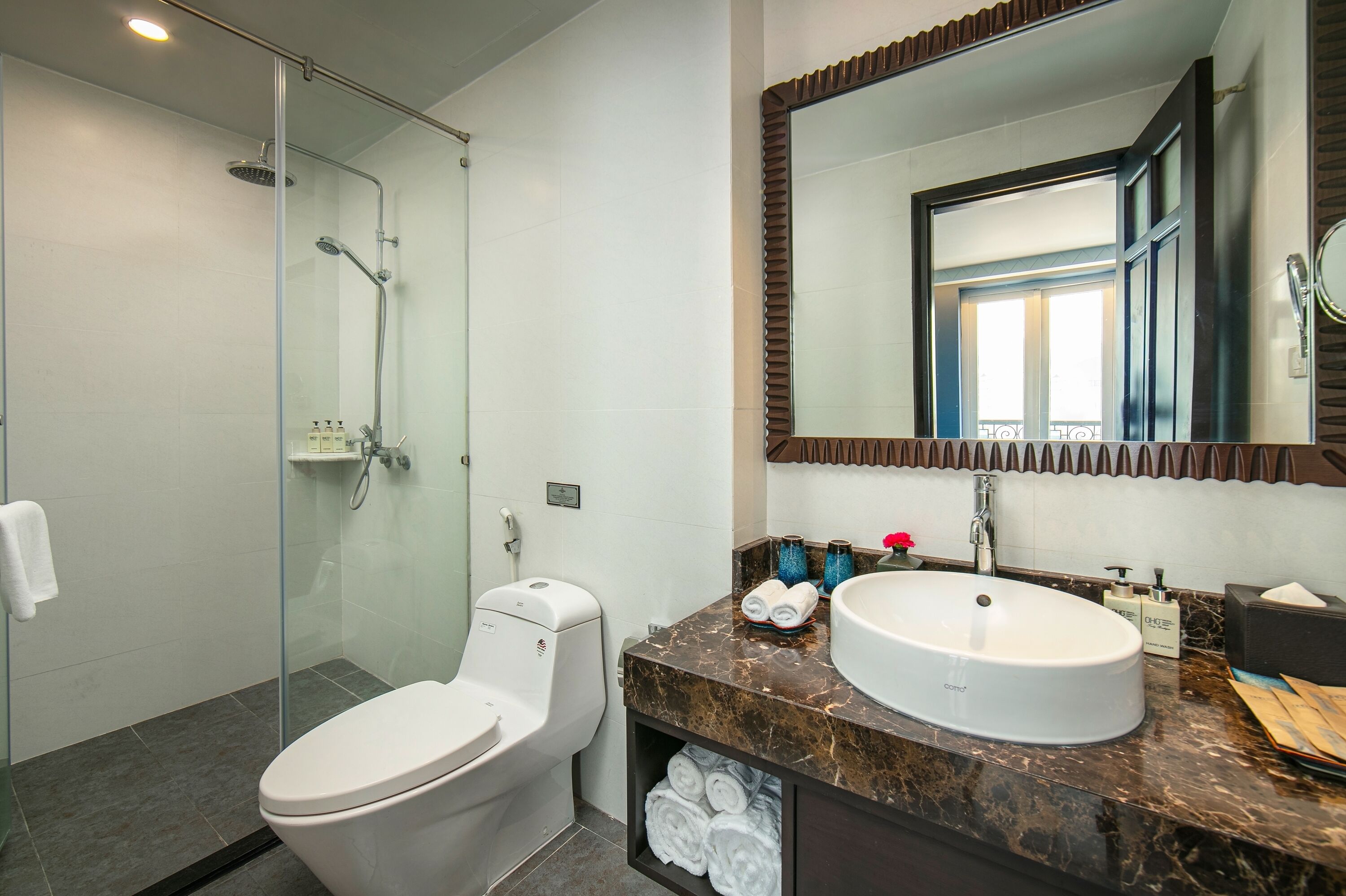 designer toiletries, hair dryer, bathrobes, slippers