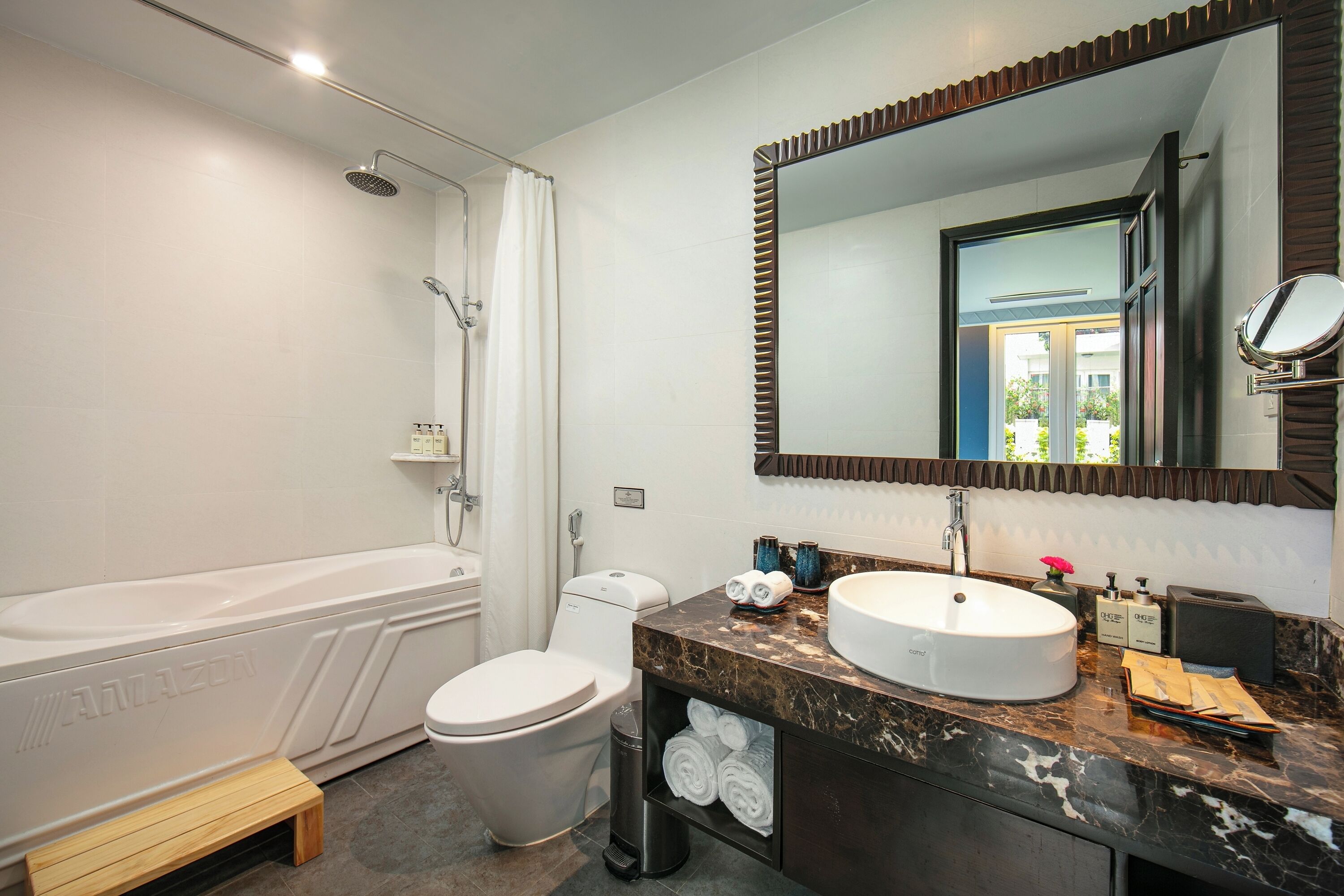 premier suite city view | bathroom | designer toiletries, hair dryer, bathrobes, slippers