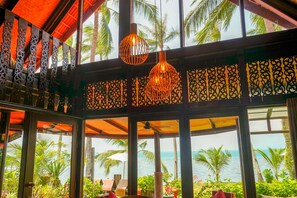 Deluxe Villa, 2 Bedrooms, Patio, Beachfront | Living room | Flat-screen TV - The Natives Samui (Koh Samui)