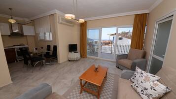 Apartment, 1 Bedroom, Sea View | Living area | LED TV