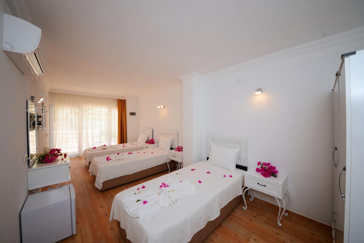 Signature Triple Room, Garden Area | Desk, free WiFi, bed sheets