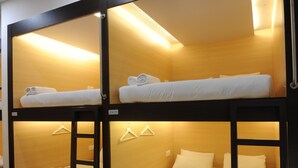 A bunk bed room with two levels, each with a bed and a hanging light. - Star Anise Boutique Capsule (Colombo)