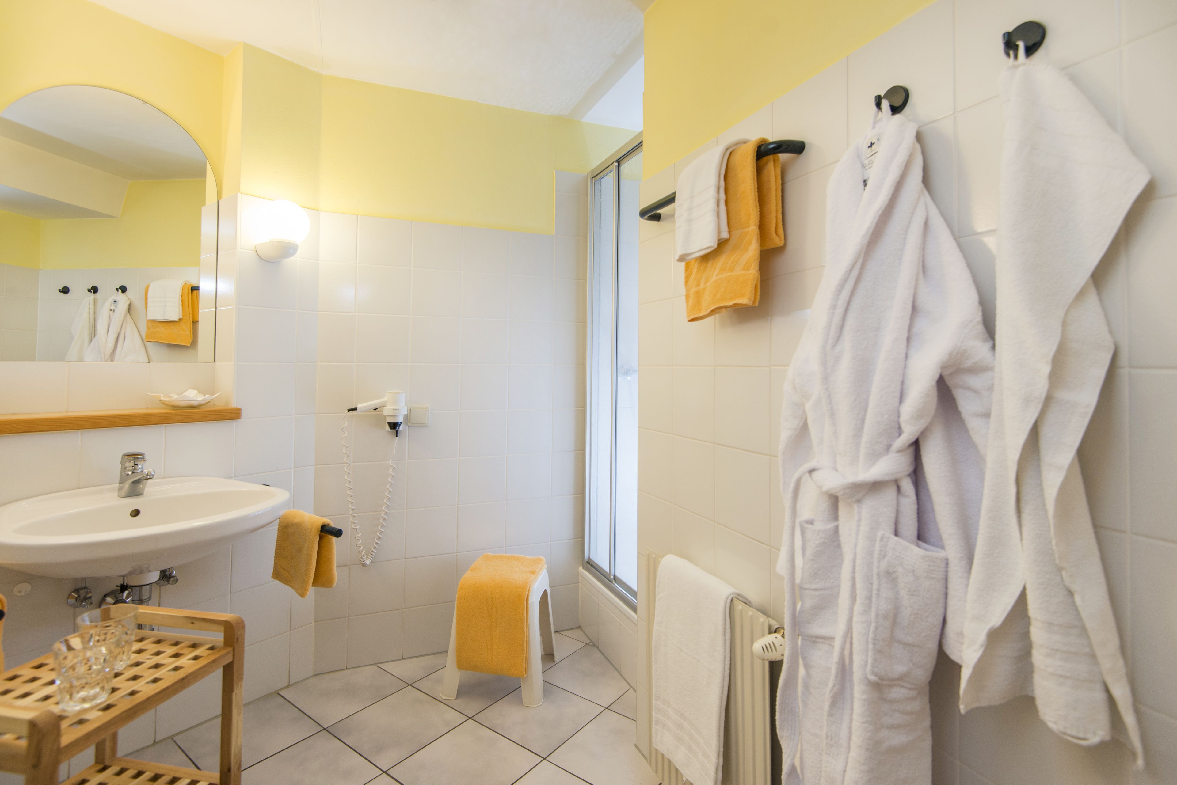 shower, hair dryer, bathrobes, towels