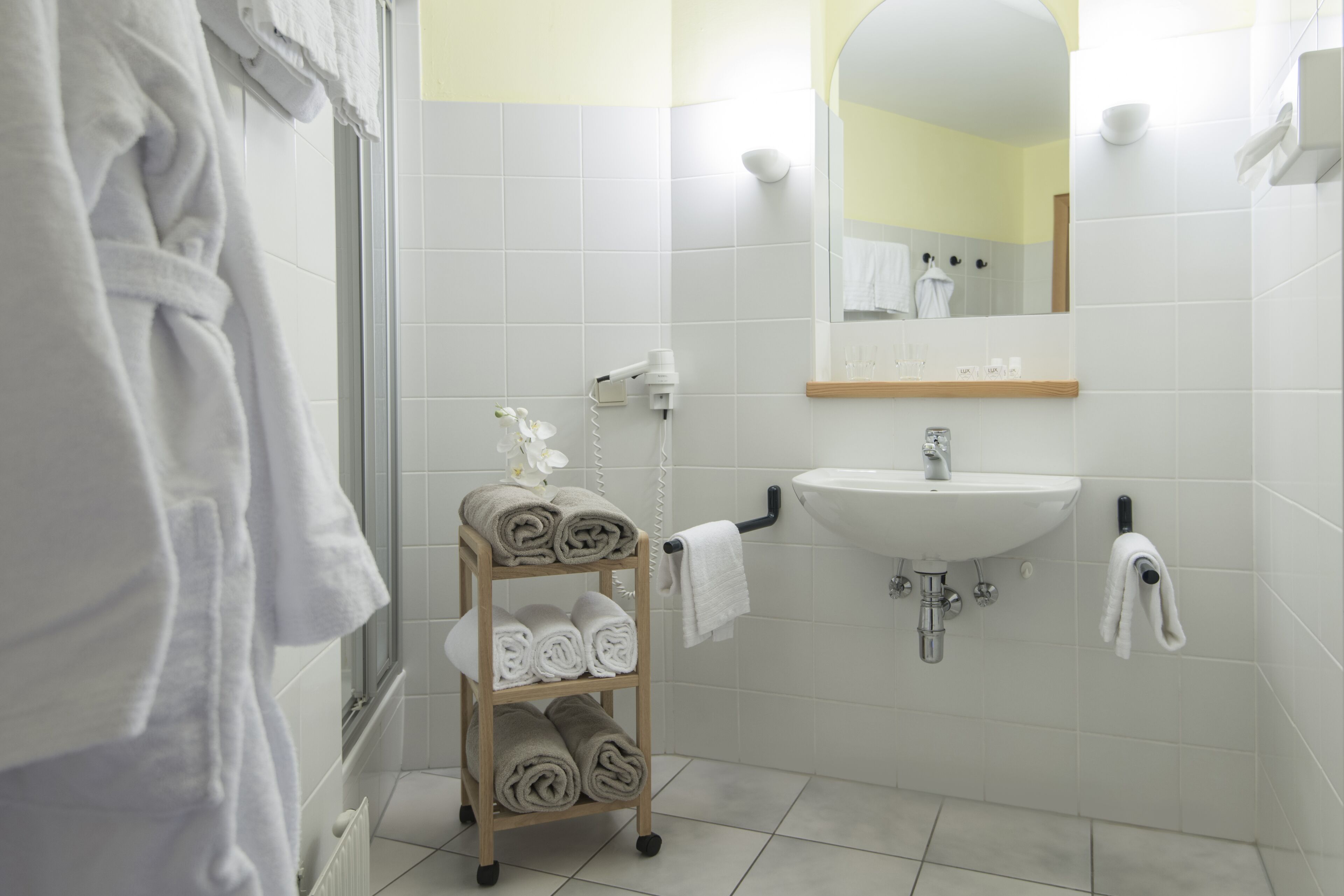 shower, hair dryer, bathrobes, towels