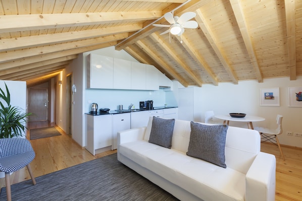 Superior Loft, Balcony, Garden View | Living area | 33-inch flat-screen TV with satellite channels, TV, DVD player