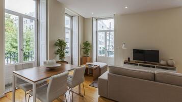 Deluxe Apartment, City View | Living room | 36-inch flat-screen TV with cable channels, TV, DVD player