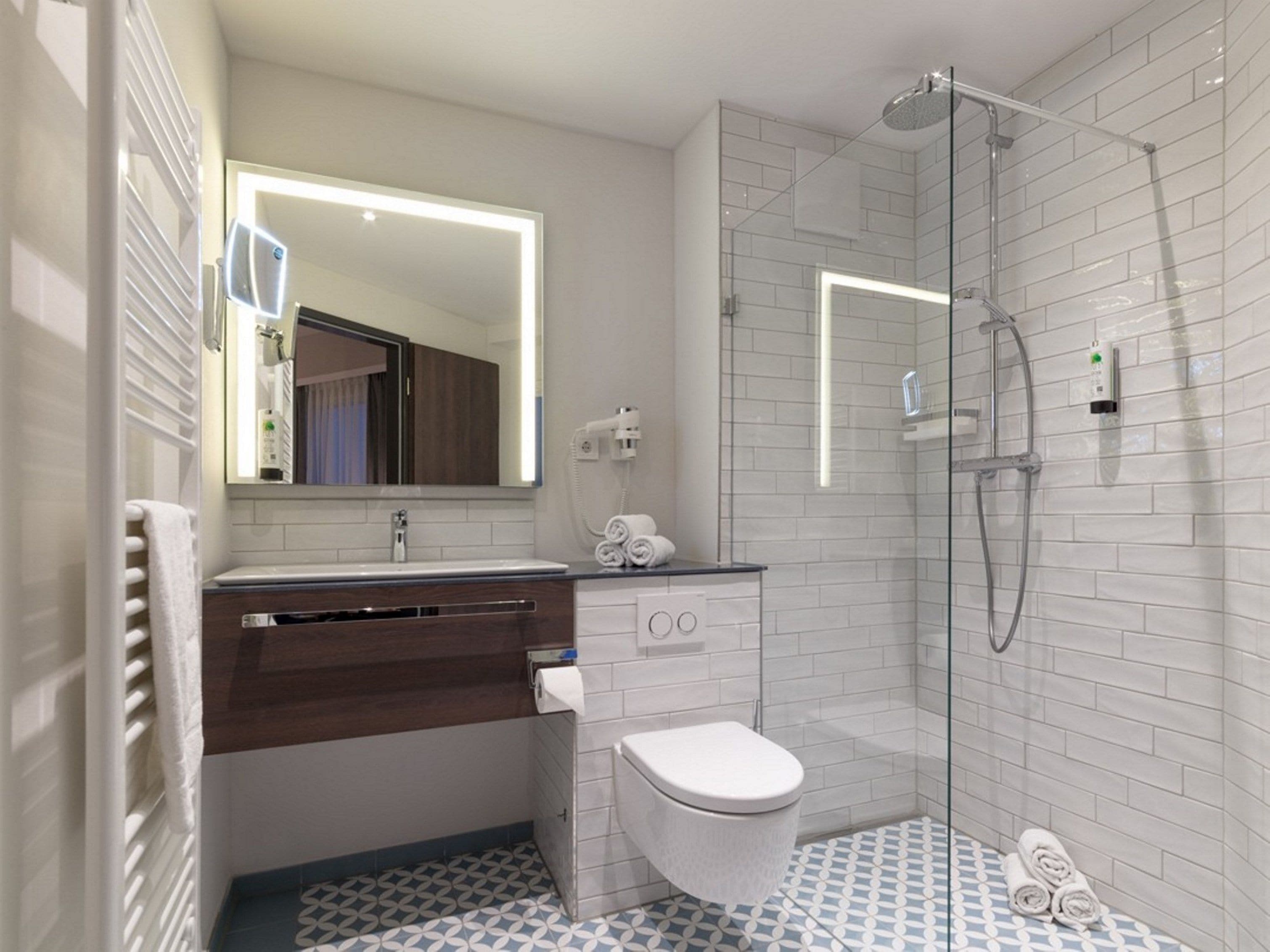 studio with king bed | bathroom | shower, free toiletries, towels