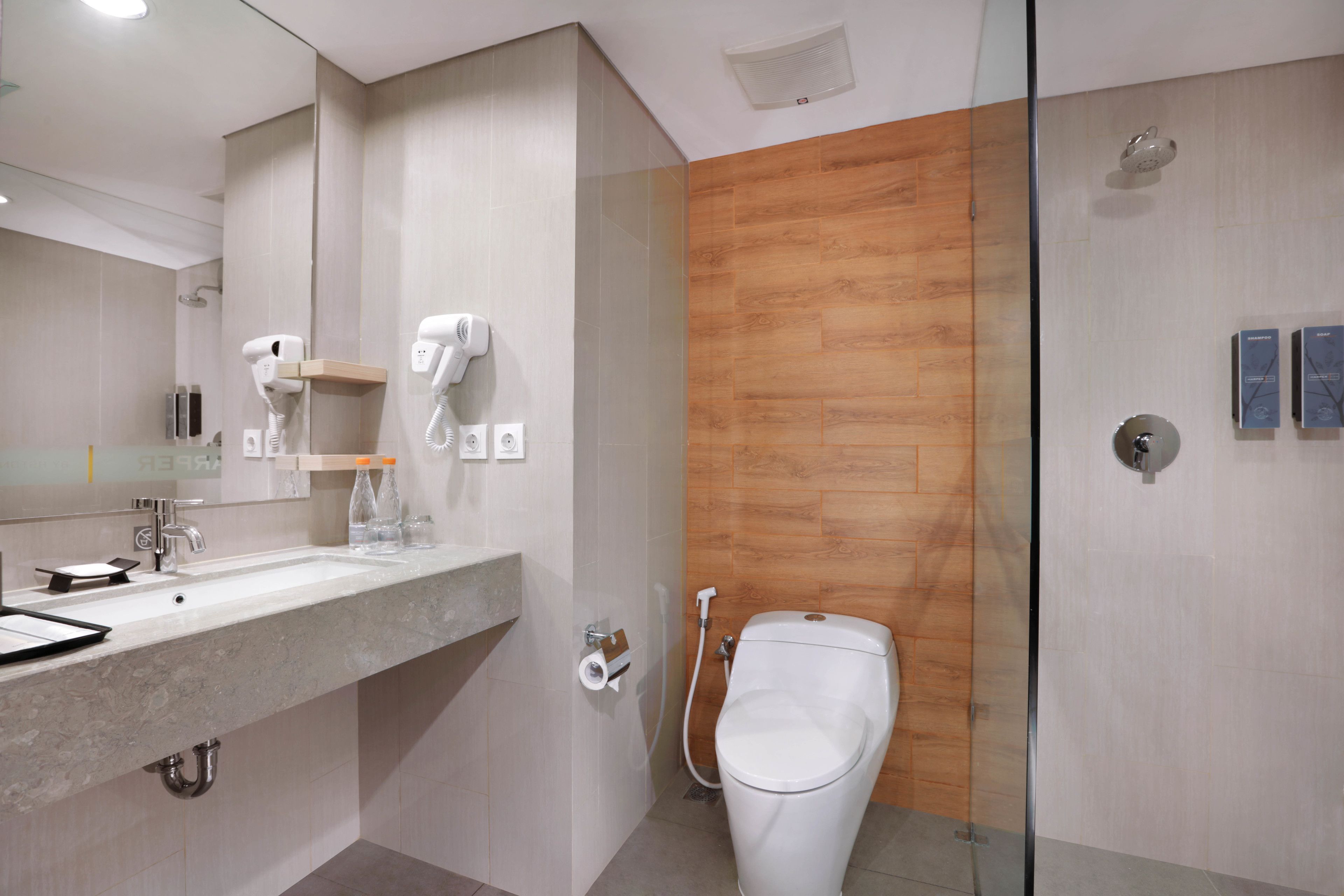 deluxe double or twin room | bathroom | rainfall showerhead, free toiletries, hair dryer, slippers