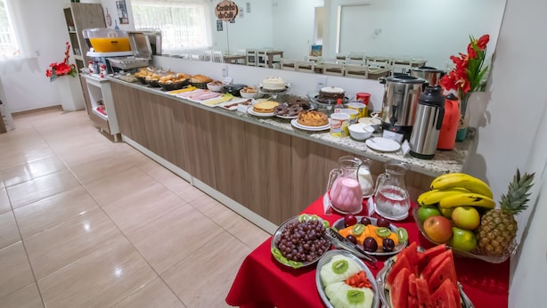 A breakfast buffet with various food items and beverages.