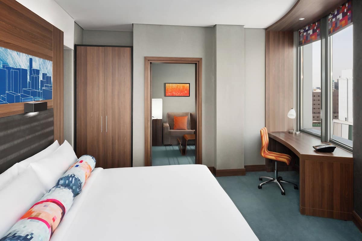 Suite, 1 King Bed, City View | In-room safe, desk, soundproofing, iron/ironing board