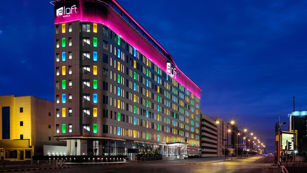 A multi-story hotel with a modern design, featuring a prominent 'ALoft' sign on the top. - Aloft by Marriott Riyadh (Riyadh)