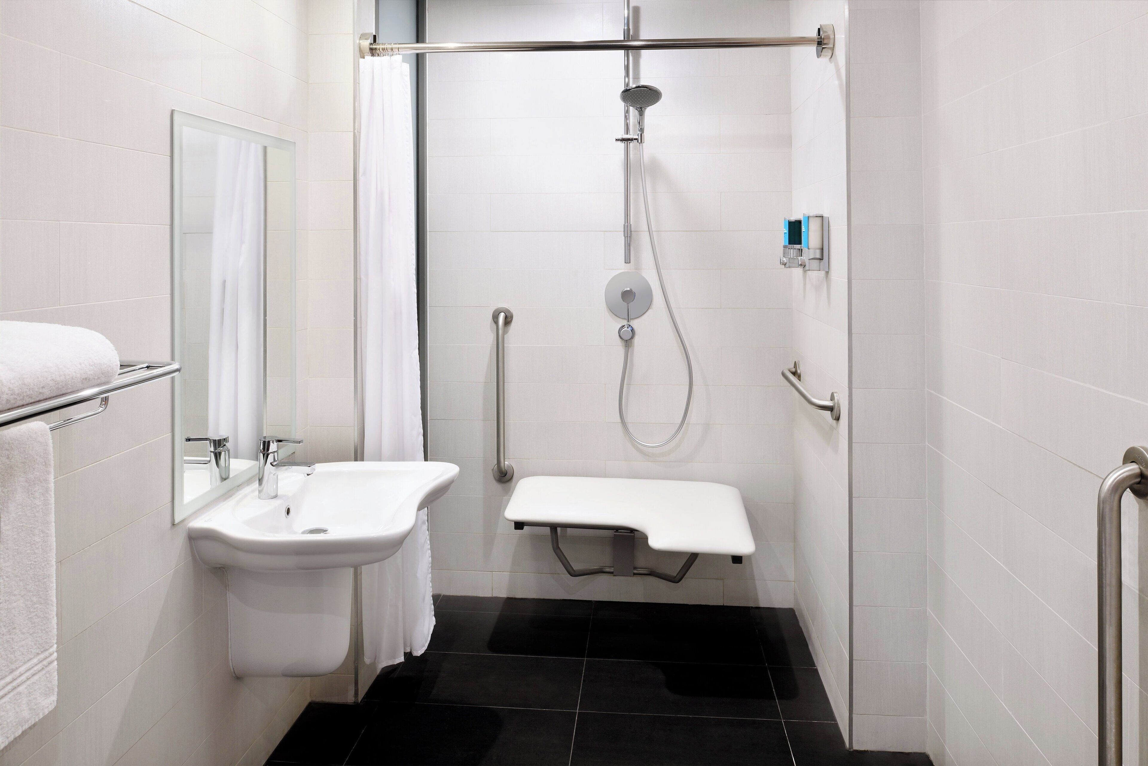 shower, designer toiletries, hair dryer, slippers