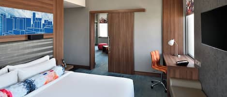 Suite, 1 King Bed, City View | In-room safe, desk, soundproofing, iron/ironing board