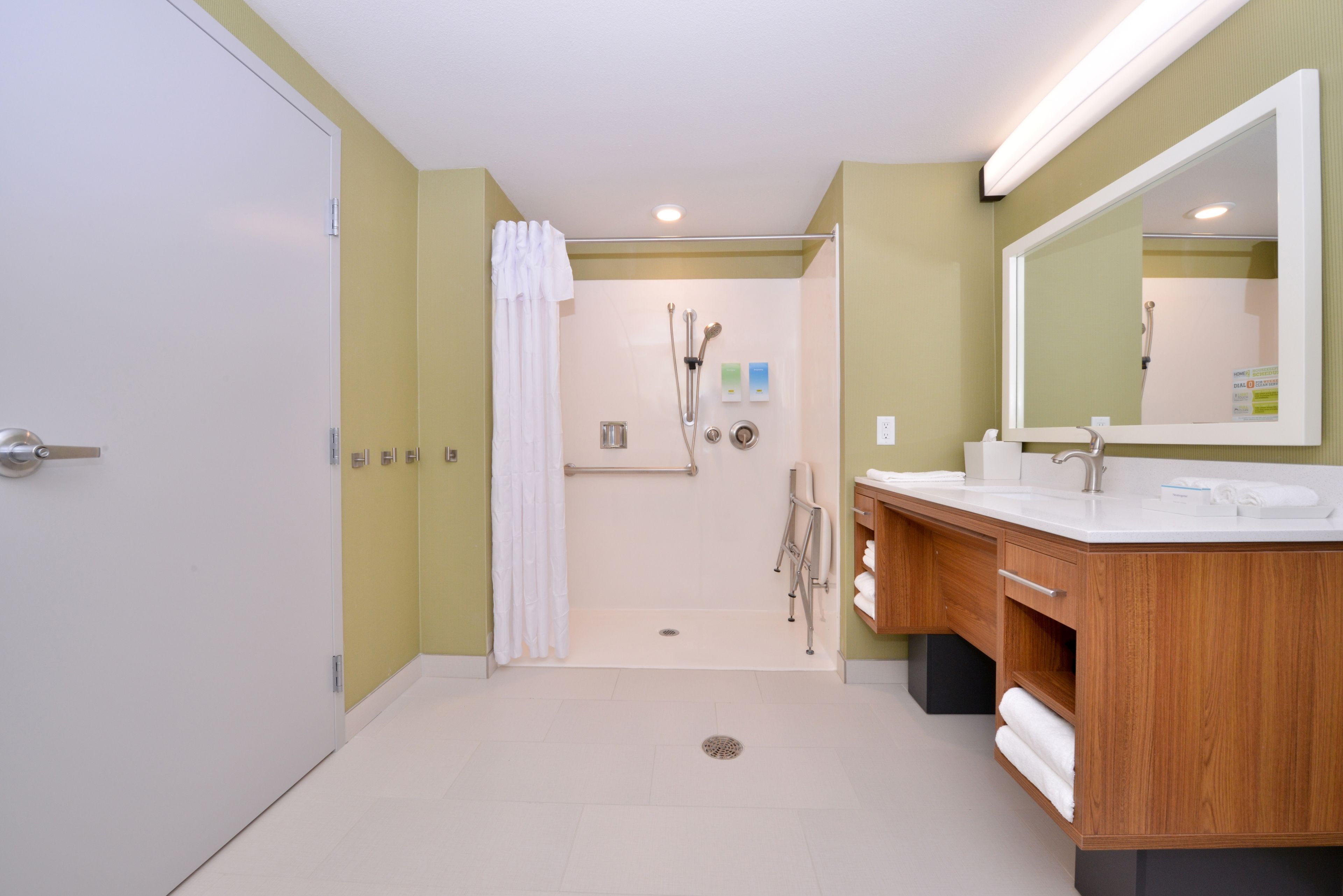 suite, 1 king bed, accessible (roll in shower) | bathroom | free toiletries, towels