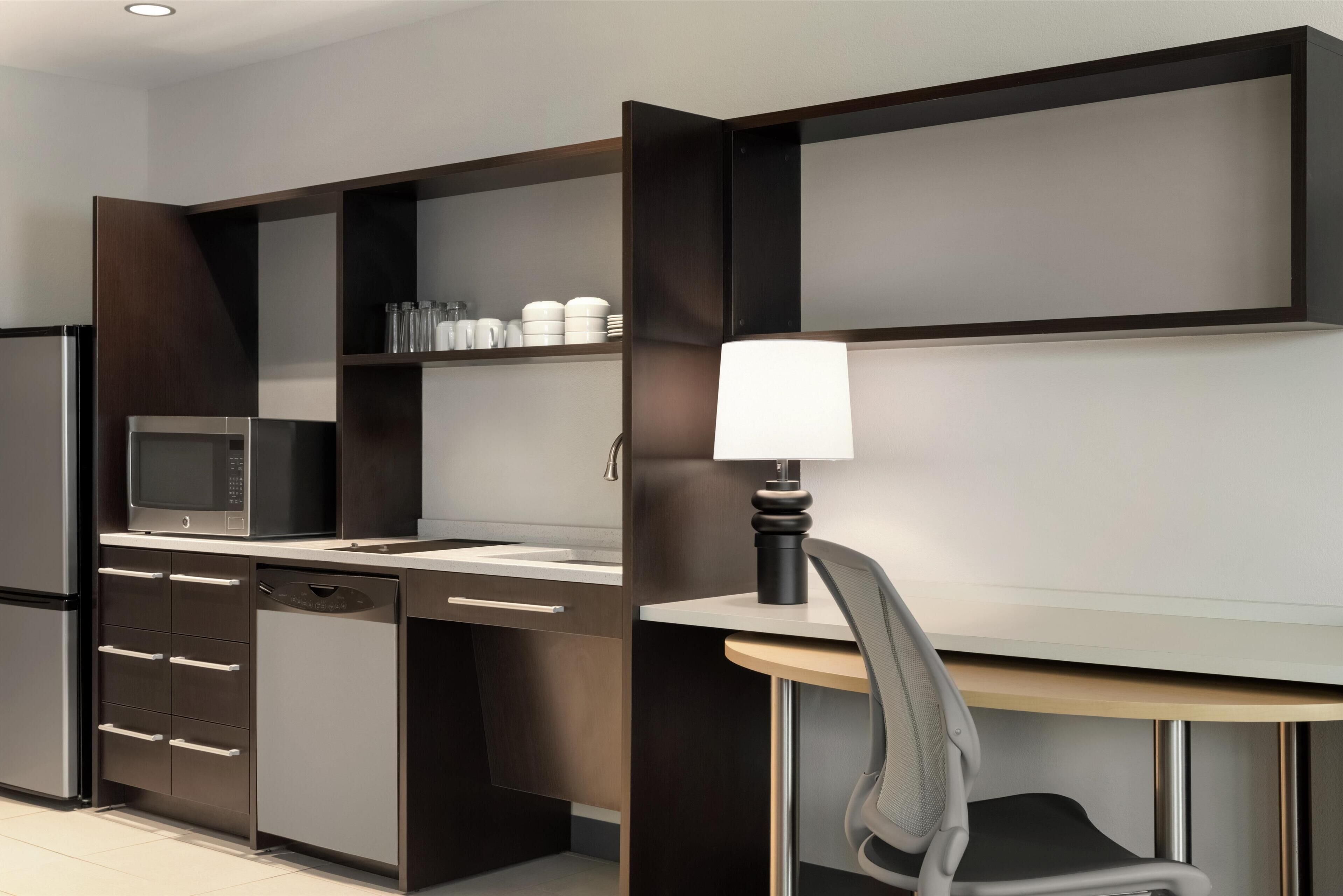 full-sized fridge, microwave, dishwasher, cookware/dishes/utensils