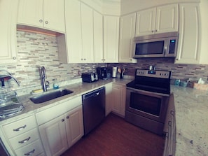 Luxury Apartment, 1 Bedroom, Accessible, Ocean View | Private kitchen | Full-size fridge, microwave, oven, stovetop - Ocean Front Surf Condominium (Hampton)
