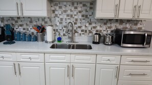 Executive Apartment, 2 Bedrooms, Garden View, Executive Level | Private kitchen | Full-sized fridge, microwave, oven, coffee/tea maker - New Kingston Guest Apartment at Donhead (Kingston)