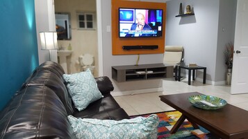 Executive Apartment, 2 Bedrooms, Garden View, Executive Level | Living room | 50-inch flat-screen TV with cable channels, TV, DVD player