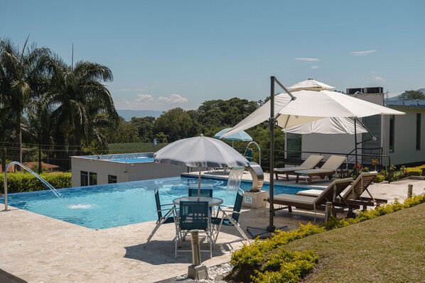Outdoor pool, pool umbrellas, pool loungers