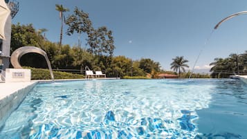Outdoor pool, pool umbrellas, pool loungers