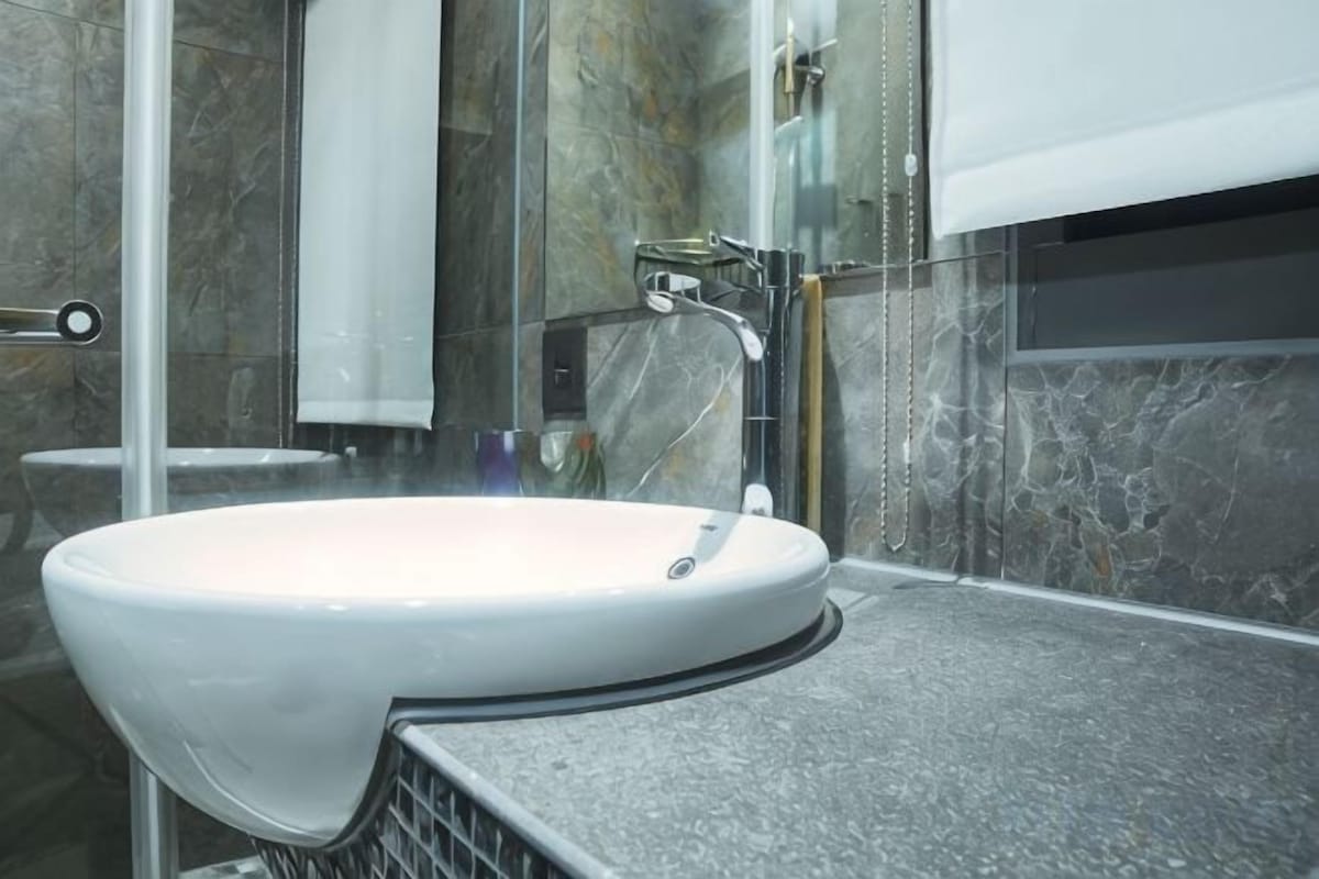 Bathroom | Rainfall showerhead, hair dryer, slippers, electronic bidet