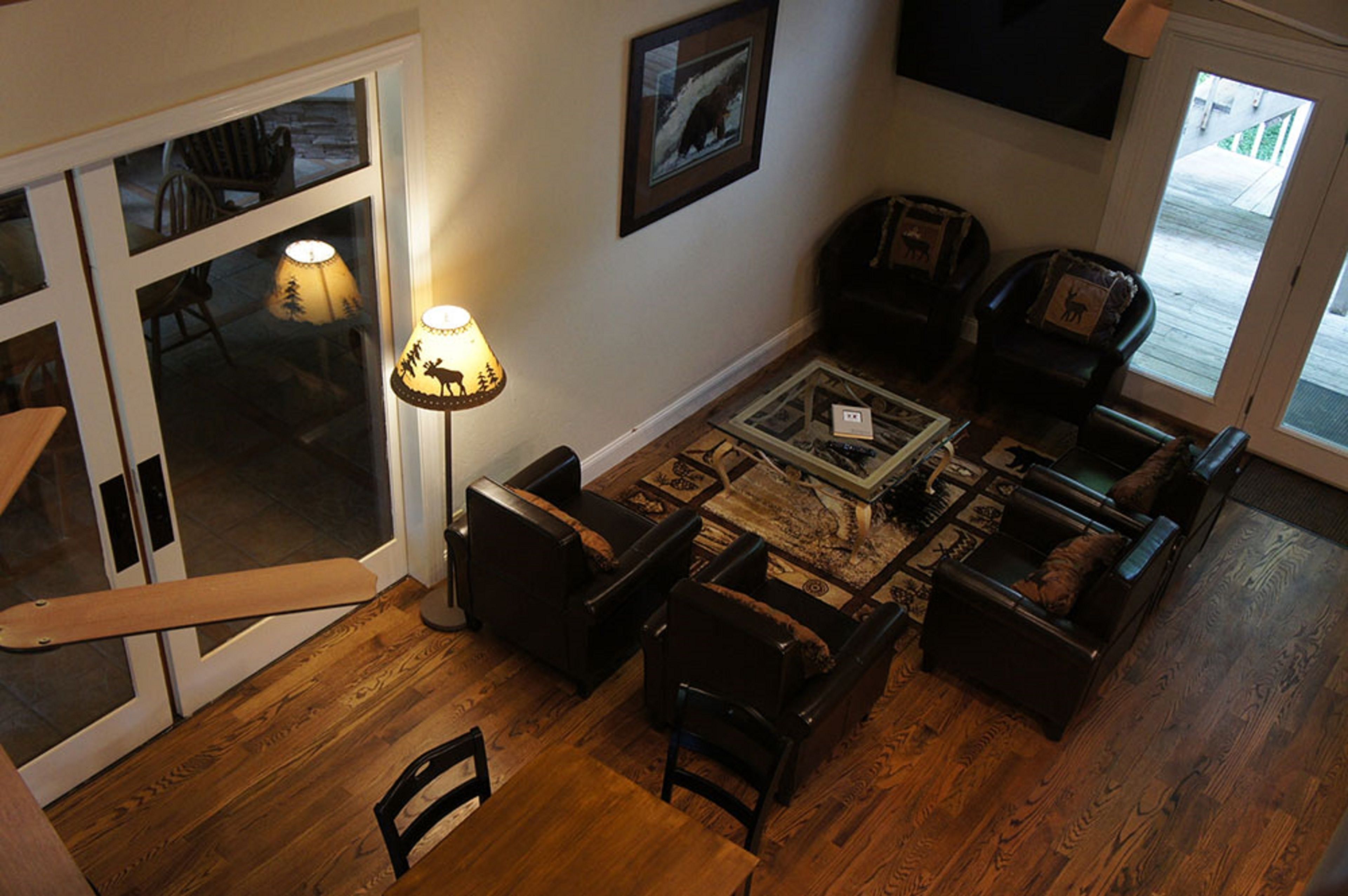 A cozy living room with a fireplace, a coffee table, and comfortable seating.