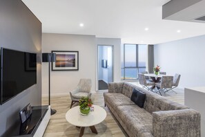 3 Bedroom Ocean Suite | Living area | Flat-screen TV