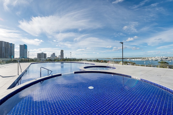 Indoor pool, outdoor pool, pool umbrellas, pool loungers