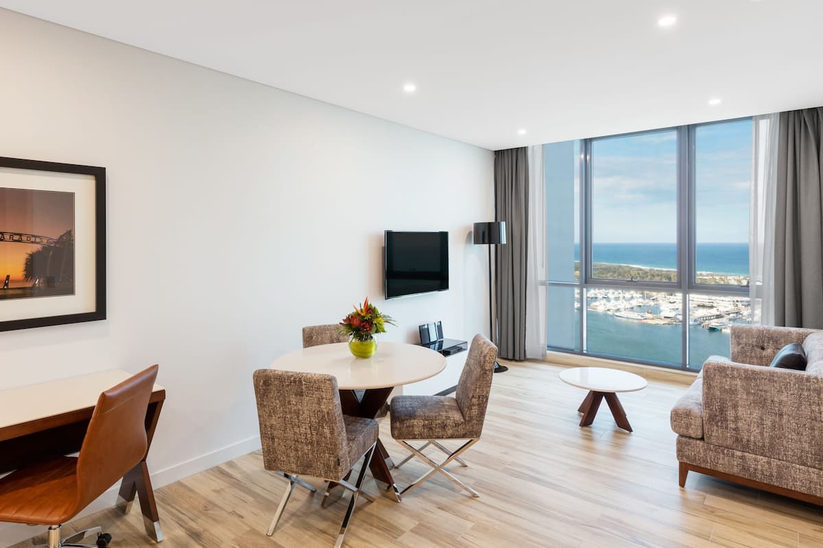 1 Bedroom Ocean Suite | Living area | Flat-screen TV