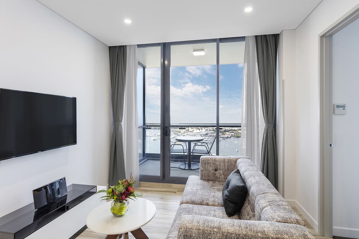 1 Bedroom Balcony Ocean Suite | Living area | Flat-screen TV