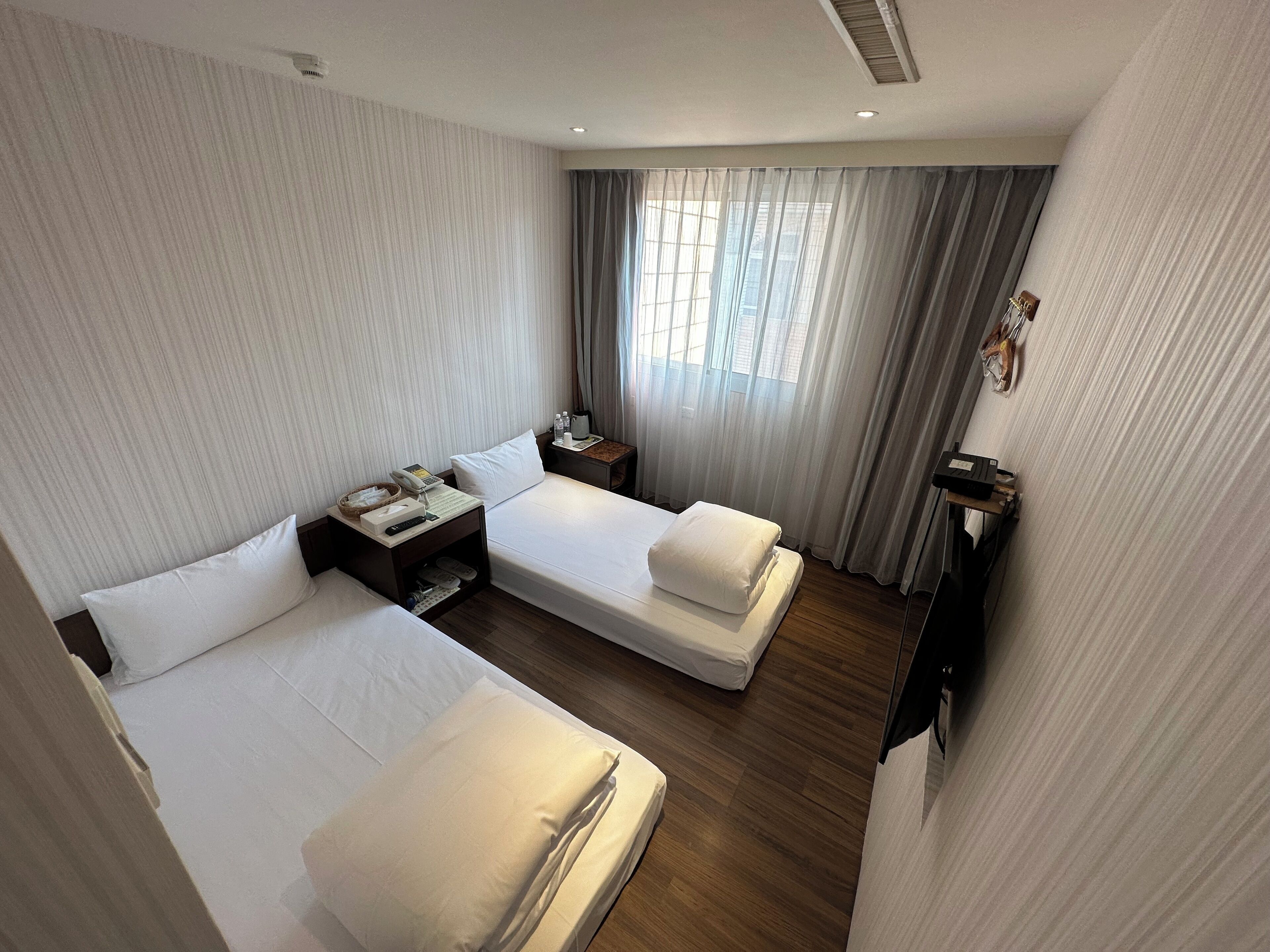 twin room, private bathroom | desk, blackout curtains, free wifi, bed sheets