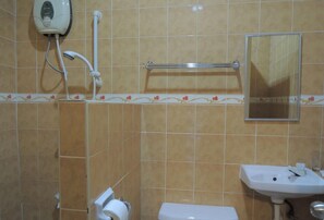 A bathroom with a toilet, sink, hand dryer, and towel rack. - Love S Beach And Dive Resort (Moalboal)