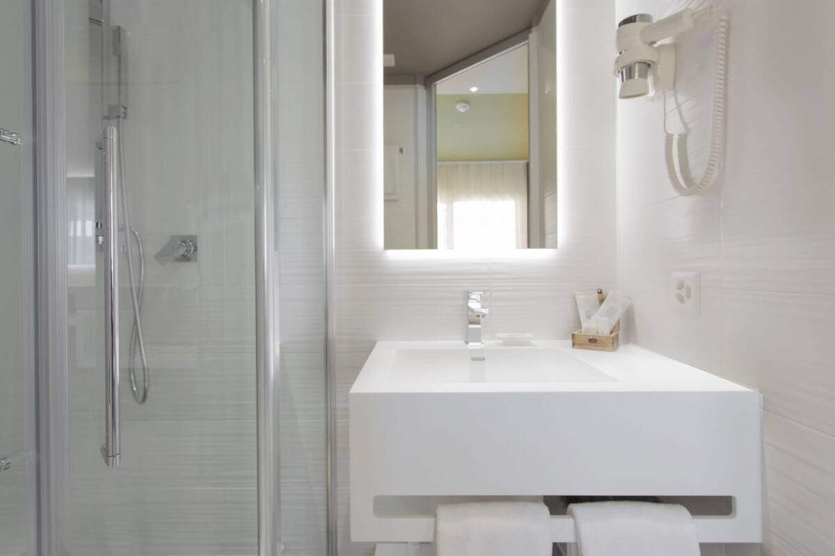 Bathroom | Shower, free toiletries, hair dryer, slippers