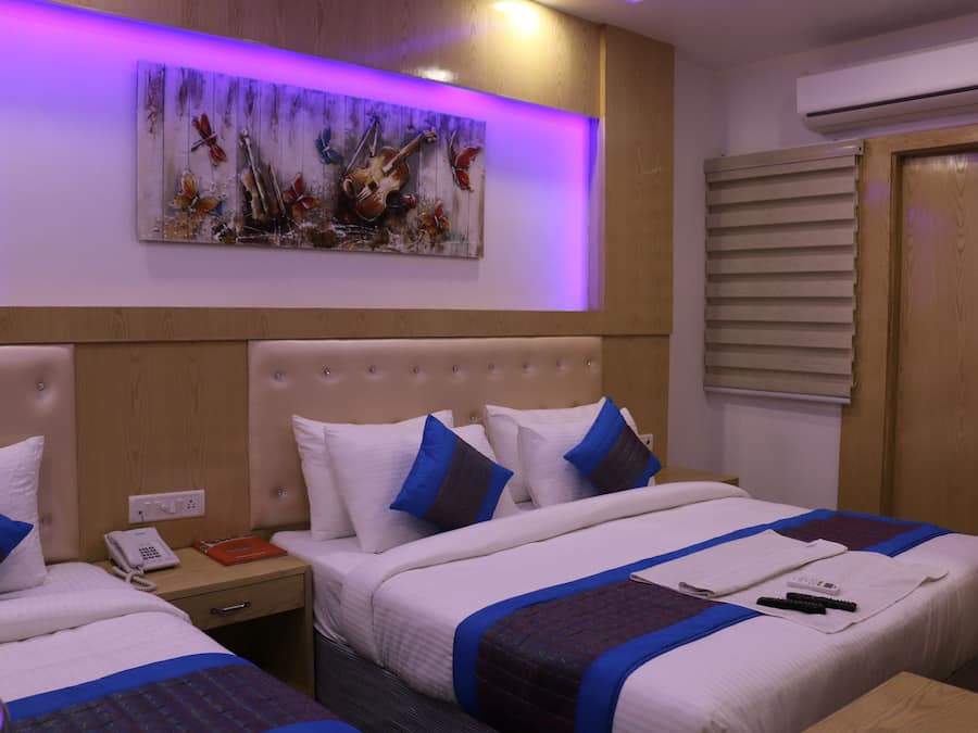 Deluxe Triple Room | Minibar, in-room safe, free WiFi, bed sheets