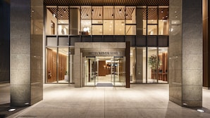 A hotel entrance with a modern design, featuring a glass facade, a wooden ceiling, and a sign that reads "HOTEL VISTA SENDA". - Hotel Vista Sendai (Sendai)