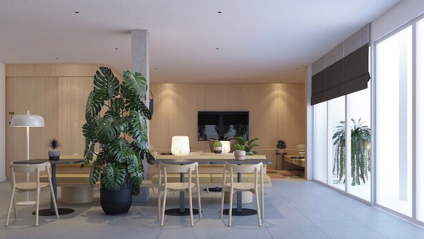 Un comedor moderno con una planta grande en maceta, una mesa de comedor y sillas.