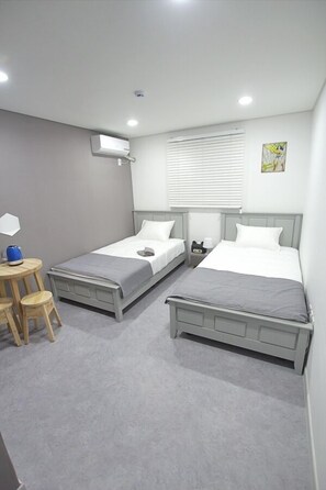 Basic Twin Room, 2 Single Beds | Bathroom | Shower, free toiletries, hair dryer, towels