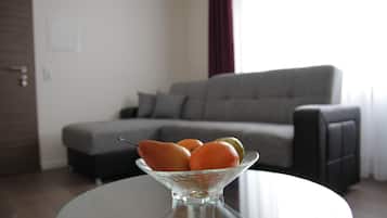 Apartment, 1 Bedroom | Living area | Flat-screen TV