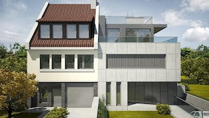 Ein modernes, zweistöckiges Haus mit Flachdach, großen Fenstern und einem gepflegten Rasen.