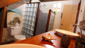 A bathroom with a toilet, a sink, and a shower. - Orange House - Over the Water Rental (Bocas del Toro)