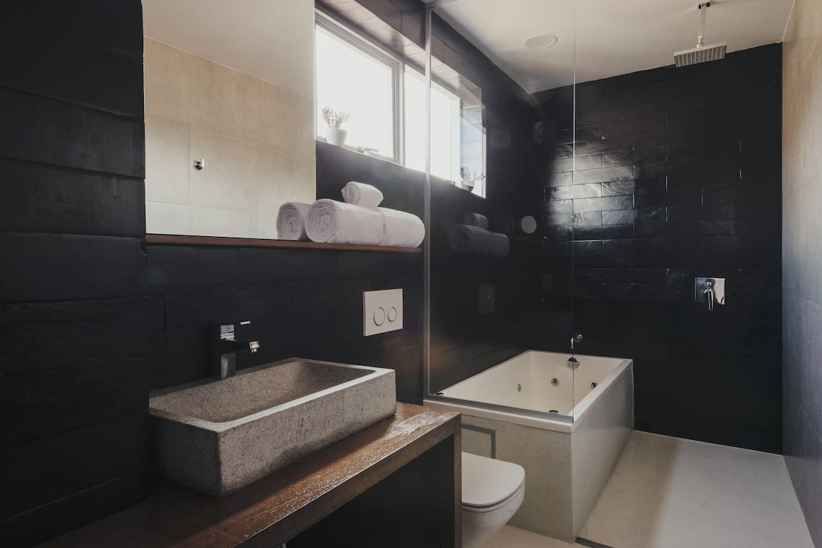 suite (atix) | bathroom | rainfall showerhead, free toiletries, hair dryer, bathrobes