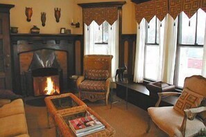 Luxury Suite, 1 King Bed, Lake View | Living area | Flat-screen TV, DVD player, books, video library