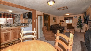 Blue Jay Cabin | Living area | 40-inch flat-screen TV with digital channels, TV, fireplace - Canyon Cabins (Ruidoso)