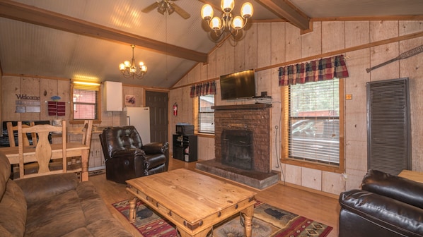 Raven Cabin | Living room | 40-inch flat-screen TV with digital channels, TV, fireplace