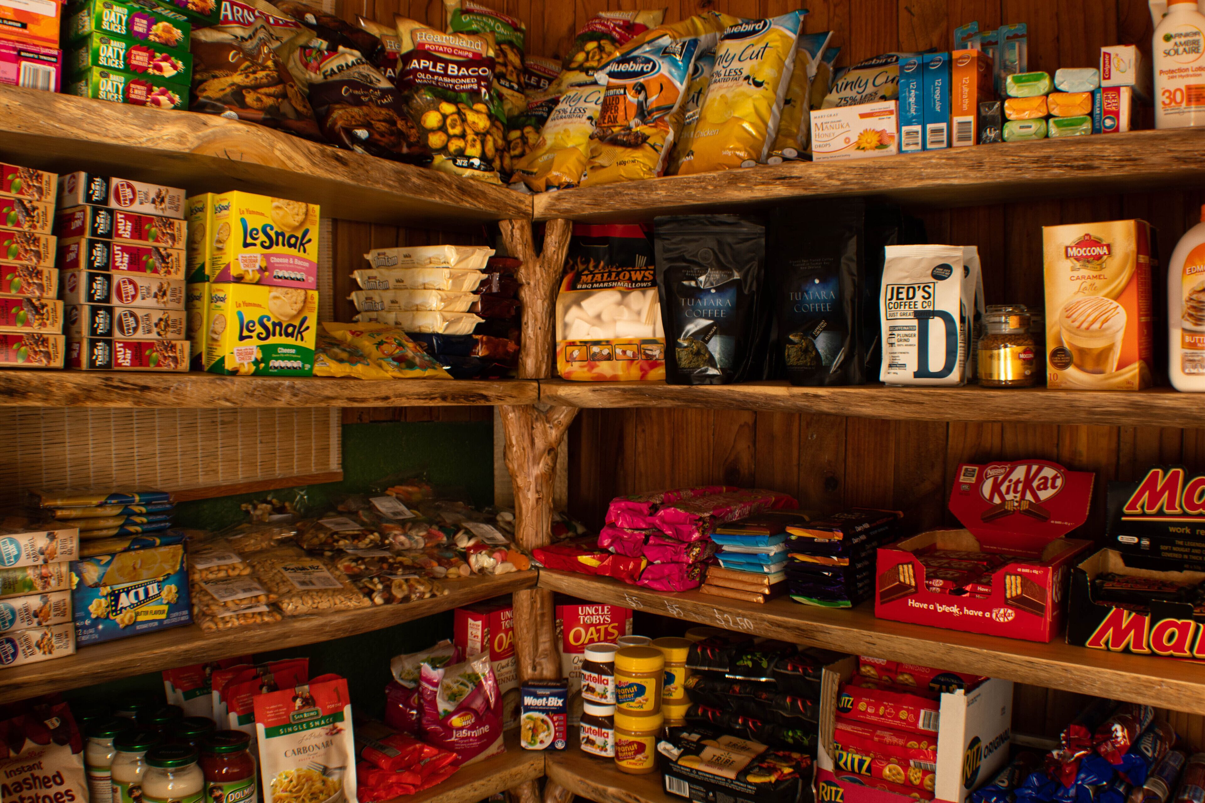 A pantry stocked with various food items and snacks.